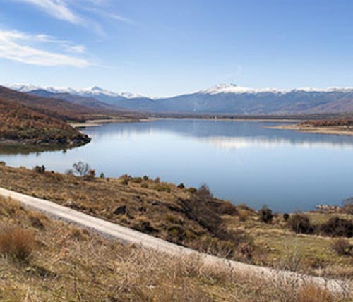 Lake at the foot of snowy peaks
